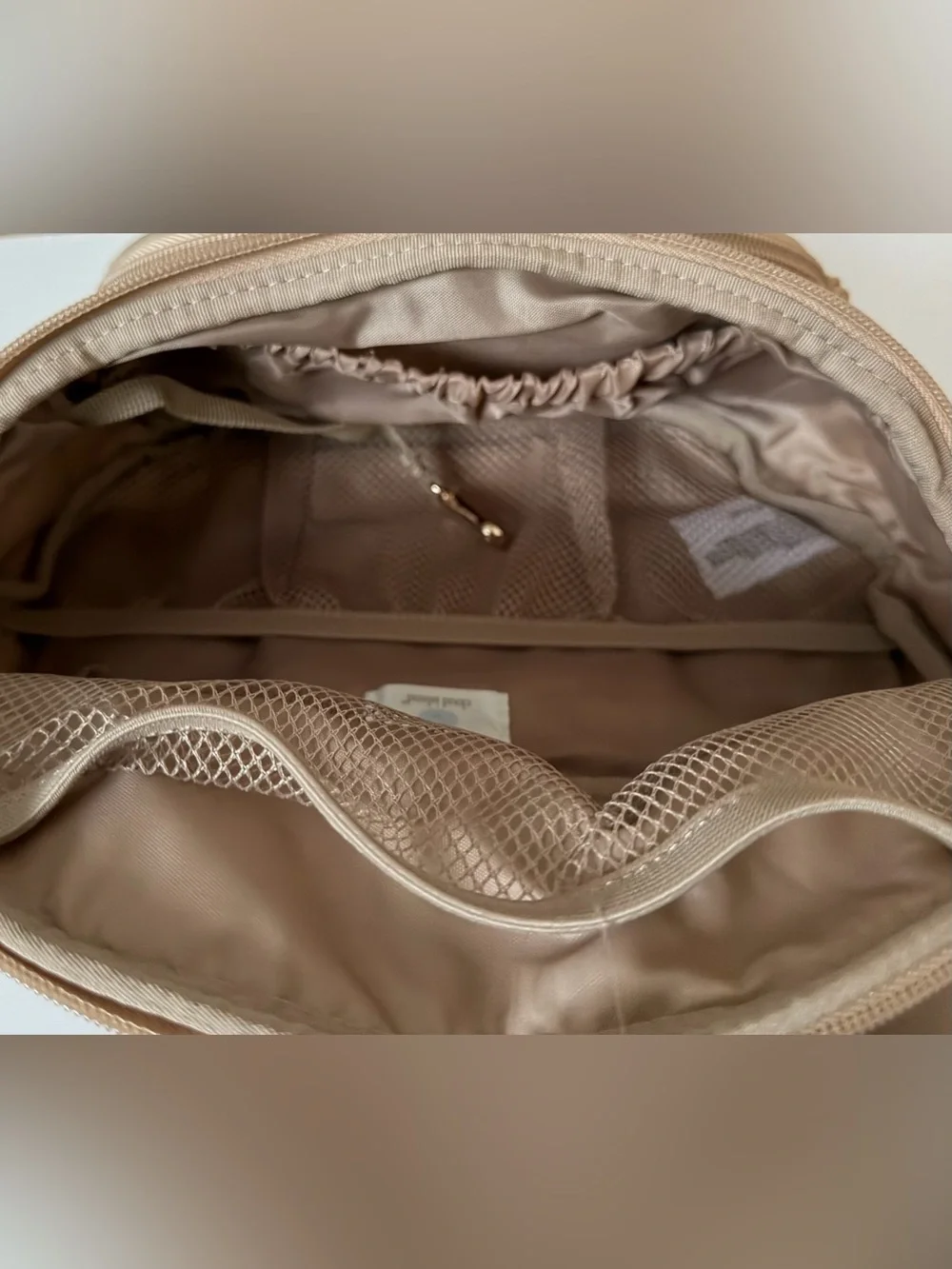 Cloud Island diaper sling in tan with checkered strap